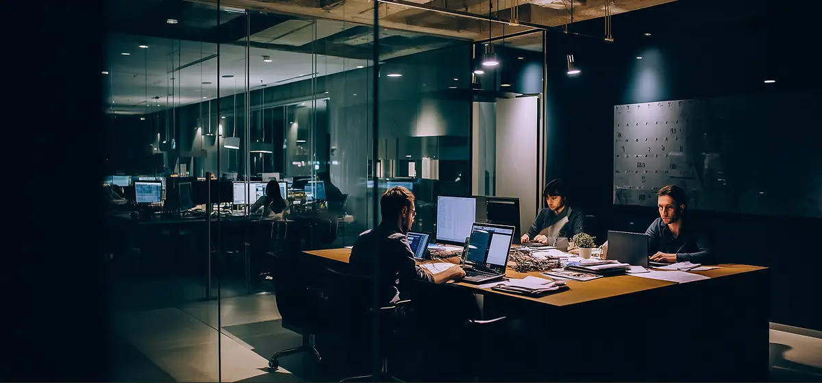 Modern workspace with an iMac displaying 'DO MORE'